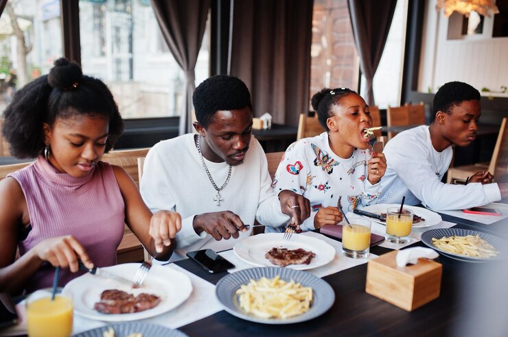 happy-african-friends-sitting-chatting-cafe-eat-food-group-black-peoples-meeting-restaurant-have-dinner_627829-5230 happy-african-friends-sitting-chatting-cafe-eat-food-group-black-peoples-meeting-restaurant-have-dinner_627829-5230