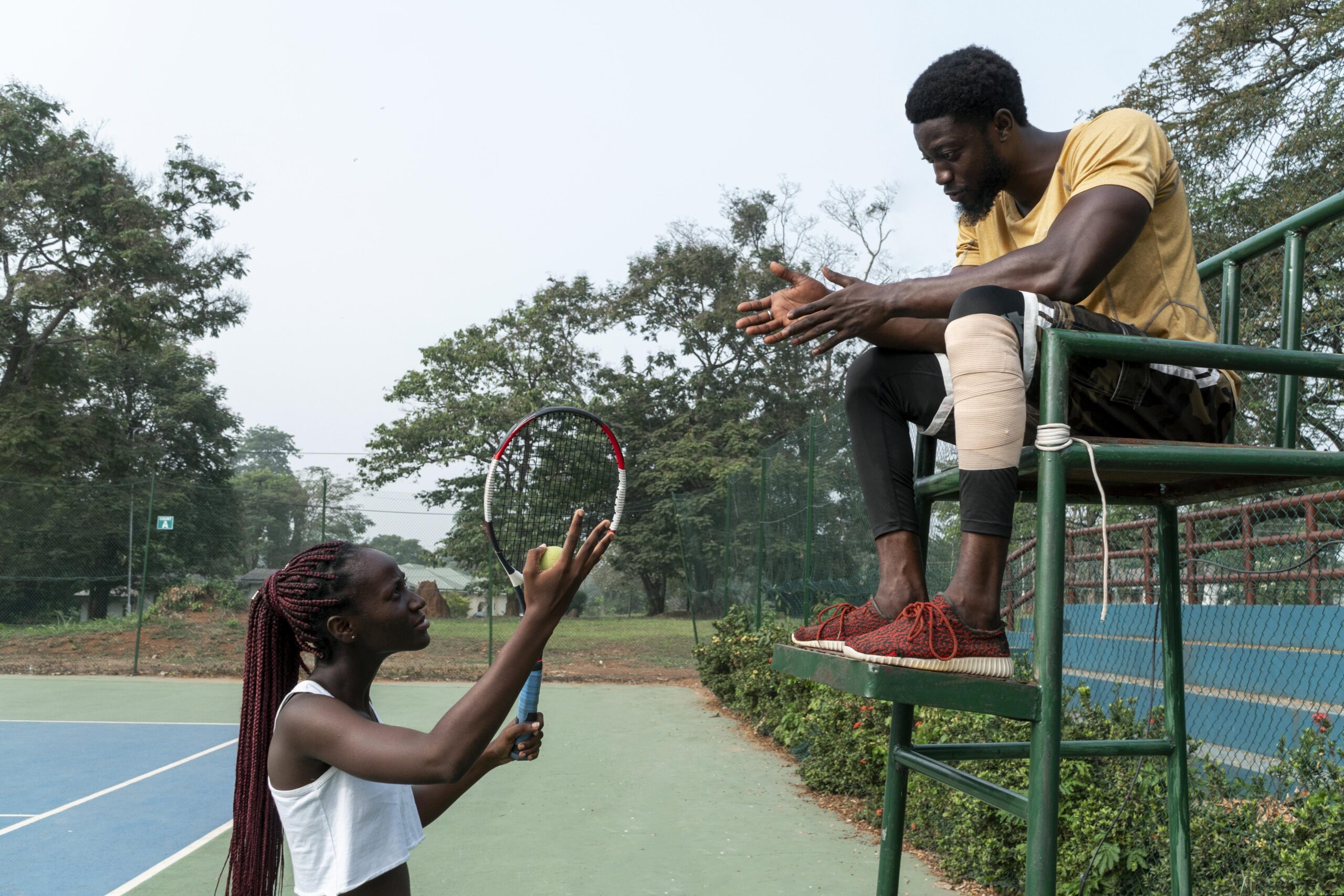man-woman-tennis-court
